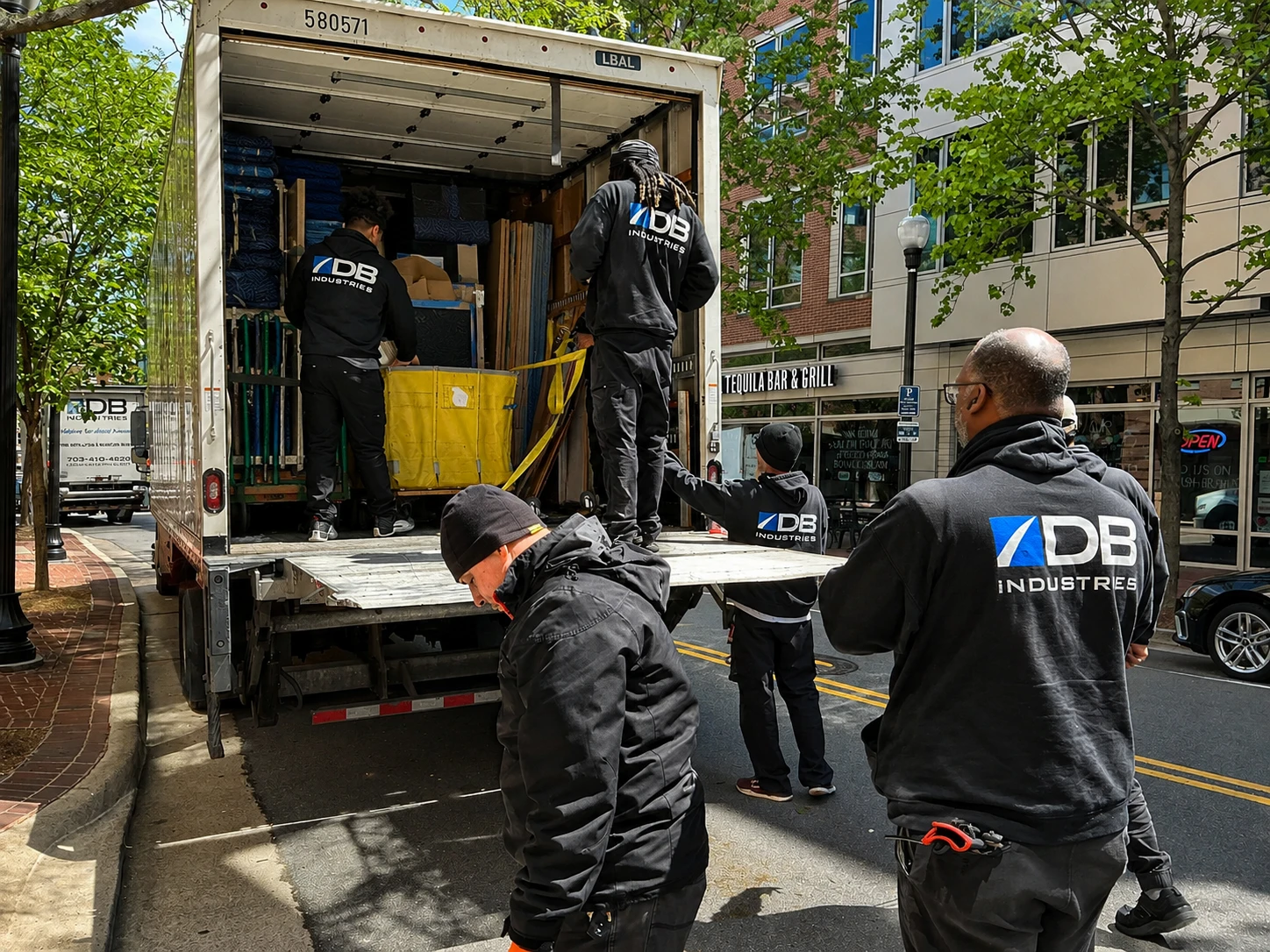 DB Industries crew unloading office furniture from truck